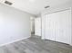 Bright bedroom with grey vinyl flooring and ample closet space at 604 Elfrida Way, Kissimmee, FL 34758