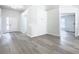 Bright and spacious entryway with gray laminate flooring and access to other rooms at 604 Elfrida Way, Kissimmee, FL 34758