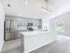 Modern kitchen with stainless steel appliances and an island at 604 Elfrida Way, Kissimmee, FL 34758