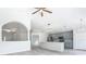 Modern kitchen with gray cabinets, island, and stainless steel appliances at 604 Elfrida Way, Kissimmee, FL 34758