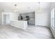 Modern kitchen with gray cabinets, stainless steel appliances, and a large island at 604 Elfrida Way, Kissimmee, FL 34758