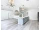 Open living area with kitchen and vaulted ceiling at 604 Elfrida Way, Kissimmee, FL 34758