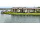 Condo building's serene lakefront location, highlighting its waterfront access at 620 Orange Dr # 228, Altamonte Springs, FL 32701