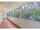 Screened balcony overlooking lush trees and nature at 690 Osceola Ave # 209, Winter Park, FL 32789