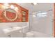 Charming bathroom with floral wallpaper and white fixtures at 690 Osceola Ave # 209, Winter Park, FL 32789