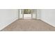 Bright bedroom with plush carpeting and access to a private balcony at 690 Osceola Ave # 209, Winter Park, FL 32789