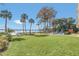Expansive grassy lawn area offering scenic lake views at 690 Osceola Ave # 209, Winter Park, FL 32789