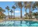 Inviting swimming pool with lake views and lush landscaping at 690 Osceola Ave # 209, Winter Park, FL 32789