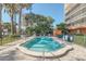 Relaxing kidney-shaped pool with surrounding patio furniture at 690 Osceola Ave # 209, Winter Park, FL 32789