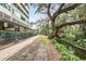 Brick walkway next to a canal, offering a serene view at 690 Osceola Ave # 209, Winter Park, FL 32789