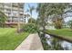 A paved walkway alongside a canal, providing scenic views at 690 Osceola Ave # 209, Winter Park, FL 32789