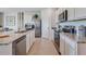 Modern kitchen with stainless steel appliances and granite countertops at 7101 Painted Bunting Way, St Cloud, FL 34773