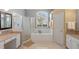 Elegant bathroom with soaking tub, shower, and double vanity at 729 Timberwilde Ave, Winter Springs, FL 32708