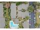 Apartment complex featuring a pool and parking area at 734 E Michigan St # 113, Orlando, FL 32806
