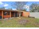Backyard with basketball hoop and partial fencing at 734 E Michigan St # 113, Orlando, FL 32806
