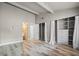 Spacious bedroom with ample closet space and wood-look flooring at 734 E Michigan St # 113, Orlando, FL 32806