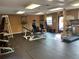 Gym features modern equipment including treadmill, elliptical and free weights in well-lit room at 734 E Michigan St # 113, Orlando, FL 32806
