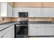 Sleek kitchen with stainless steel appliances and dark countertops at 734 E Michigan St # 113, Orlando, FL 32806