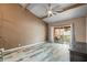 Living room with sliding doors opening to a private patio at 734 E Michigan St # 113, Orlando, FL 32806