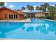 Community pool with surrounding patio and lounge chairs at 734 E Michigan St # 113, Orlando, FL 32806