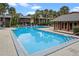 Community pool with adjacent clubhouse and ample space at 734 E Michigan St # 113, Orlando, FL 32806