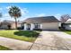 Single-Gathering home with driveway, landscaping, and neighboring houses visible at 783 Tomlinson Ter, Lake Mary, FL 32746