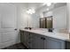 Elegant bathroom with double sinks and a large mirror at 8137 Surf St, Kissimmee, FL 34747