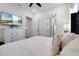 Well-appointed bedroom with a comfortable bed and built-in TV at 8137 Surf St, Kissimmee, FL 34747