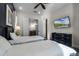 Guest bedroom with twin beds, dark dresser and en-suite bathroom at 8137 Surf St, Kissimmee, FL 34747