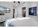 Bright bedroom with a large bed, dresser, and TV at 8137 Surf St, Kissimmee, FL 34747