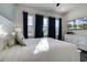 Relaxing bedroom with a comfy bed and plenty of natural light at 8137 Surf St, Kissimmee, FL 34747