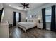 Main bedroom with a white bed frame and blue accents at 8137 Surf St, Kissimmee, FL 34747