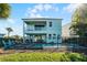 Back view of house, showcasing pool and patio at 8137 Surf St, Kissimmee, FL 34747