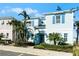 Two-story light blue house with blue shutters at 8137 Surf St, Kissimmee, FL 34747