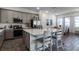 Modern kitchen with gray cabinets and a large island at 8137 Surf St, Kissimmee, FL 34747