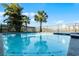 Community pool with surrounding landscaping at 8137 Surf St, Kissimmee, FL 34747