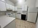 Clean kitchen, white cabinets, and black dishwasher at 8306 Golden Chickasaw Cir, Orlando, FL 32825