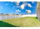 Fenced-in backyard with grassy lawn at 878 Galloway St, Lake Alfred, FL 33850