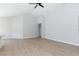 Spacious living room with wood-look floors and neutral walls at 878 Galloway St, Lake Alfred, FL 33850