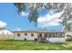 Expansive backyard features a screened porch perfect for outdoor relaxation at 8836 Ava Lake Dr, Orlando, FL 32810