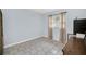 Neutral bedroom with a window, tile floors and closet space at 8836 Ava Lake Dr, Orlando, FL 32810
