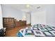 Cozy bedroom with wood floors, natural light, and classic furnishings at 8836 Ava Lake Dr, Orlando, FL 32810