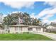 Charming single-story home with a well-manicured lawn and an American flag waving in the front yard at 8836 Ava Lake Dr, Orlando, FL 32810