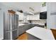 Modern kitchen with white countertops, grey cabinets, and stainless steel appliances at 8836 Ava Lake Dr, Orlando, FL 32810