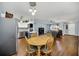 Open-concept living space features wood floors, a kitchen island and a cozy sitting area at 8836 Ava Lake Dr, Orlando, FL 32810