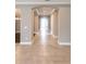 Bright hallway with tile flooring and arched doorways at 8876 Finsen St, Orlando, FL 32827