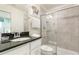 Bathroom with shower, toilet, vanity with dark countertop at 9009 Rhodes St, Kissimmee, FL 34747