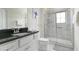 Bathroom with shower, toilet, and vanity with dark countertop at 9009 Rhodes St, Kissimmee, FL 34747