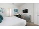 Spacious bedroom with a dresser and large TV at 9009 Rhodes St, Kissimmee, FL 34747