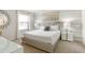 Bright bedroom with a large bed and stylish decor at 9009 Rhodes St, Kissimmee, FL 34747